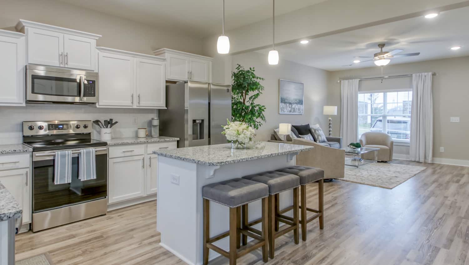 Interior view of Vastland Communities townhome kitchen with an island